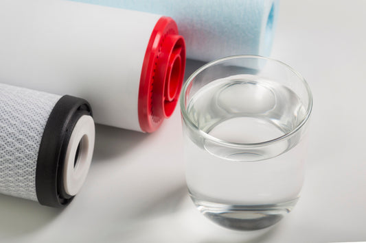 Water filter cartridges and glass of clean water